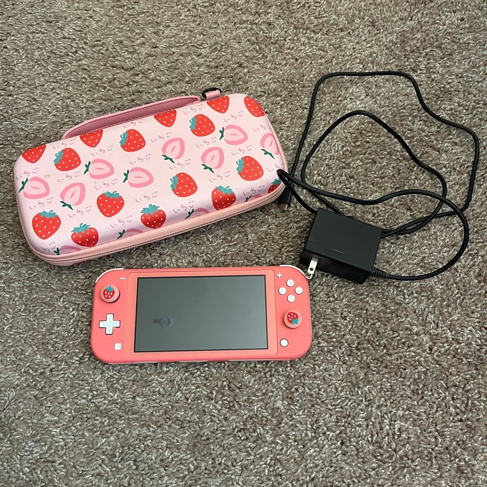 Like new condition Nintendo Switch Lite in coral